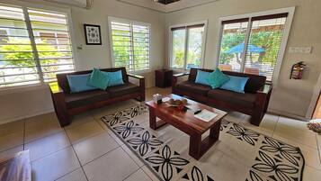 Palms Villa (Two Bedroom Beachfront) | Living area | 40-inch Smart TV with digital channels, Netflix, streaming services