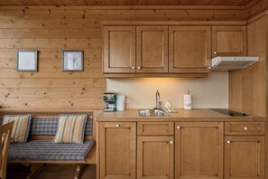 Fridge, stovetop, dishwasher, coffee/tea maker