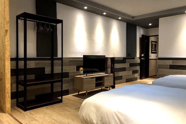 Deluxe Quadruple Room, Balcony | Down comforters, blackout drapes, soundproofing, rollaway beds