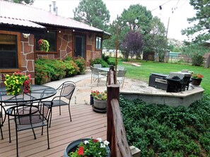Deck/patio and side yard view - Unique PET FRIENDLY Property Sleeps 15-17 Next To River/close to town  (Ruidoso Downs)
