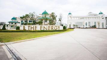 A large, white building with a sign reading "THE ENERGY" in front.