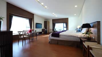 Deluxe Quadruple Room | In-room safe, desk, laptop workspace, blackout drapes