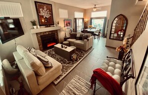 TV, fireplace, books