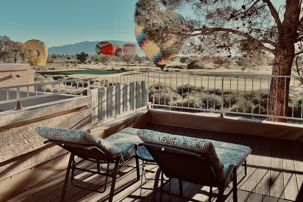 View from private veranda. Balloons glide over property and land on golf course
