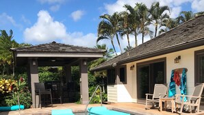 A swimming pool with lounge chairs and a covered patio area. - 5 Star, Great for Families, 4BD w/AC, HTD Pool, Poipu Beach Athletic Club access (Koloa)