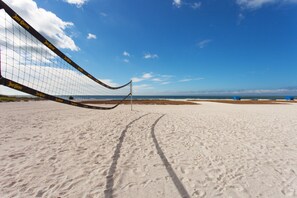 On the beach, sun loungers, beach towels