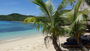 Private beach, white sand, sun-loungers, beach umbrellas