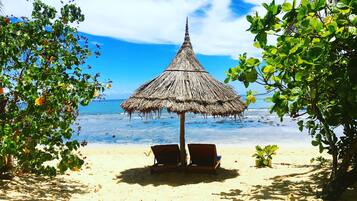 Private beach, white sand, sun loungers, beach umbrellas
