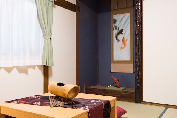 Family House, 4 Bedrooms, 2 Bathrooms | Living area | Flat-screen TV