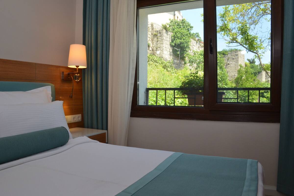 standard double room, garden view | minibar, in-room safe, soundproofing, iron/ironing board