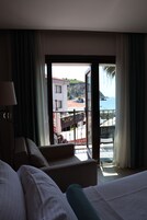 Family Suite, Partial Sea View | Minibar, in-room safe, soundproofing, iron/ironing board