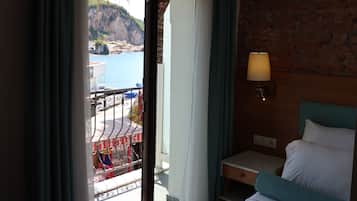 Family Suite, Partial Sea View | Minibar, in-room safe, soundproofing, iron/ironing board