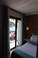 Family Suite, Partial Sea View | Minibar, in-room safe, soundproofing, iron/ironing board