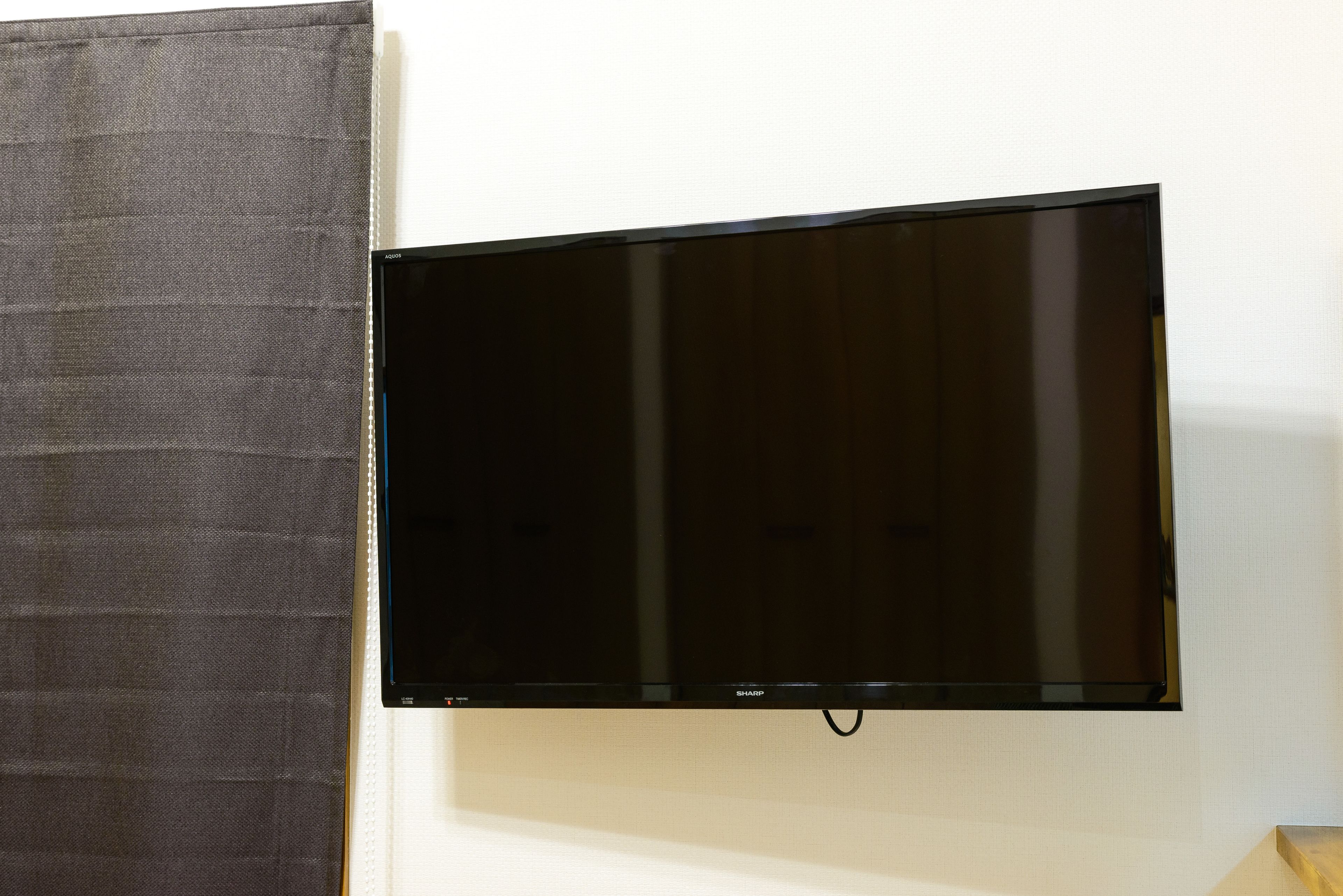 A flat-screen TV mounted on a wall.