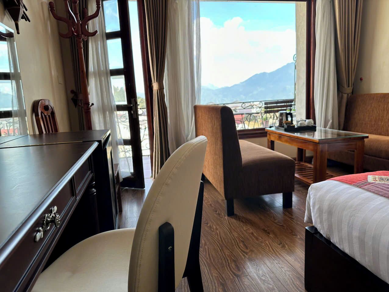 deluxe room, 1 double or 2 single beds, mountain view | minibar, in-room safe, desk, blackout curtains