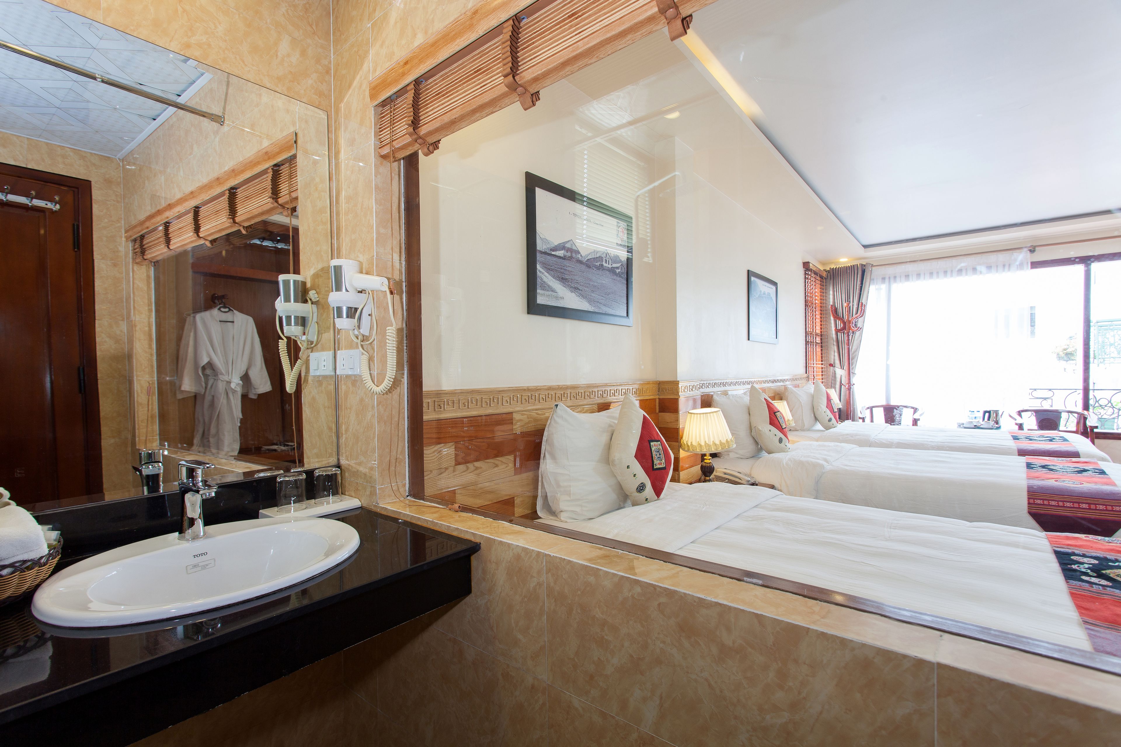 superior triple room, balcony | minibar, in-room safe, desk, blackout curtains