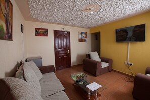 Apartment, 1 Bedroom | Living area | Flat-screen TV - Oloiboni Hotel (Nairobi)
