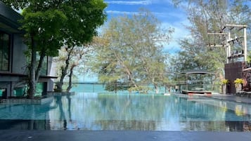 Outdoor pool, open 8:00 AM to 8:00 PM, pool loungers