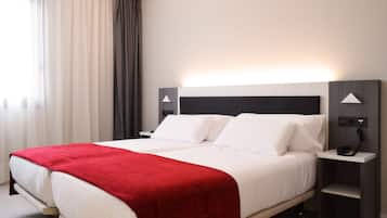 Down comforters, pillowtop beds, in-room safe, desk