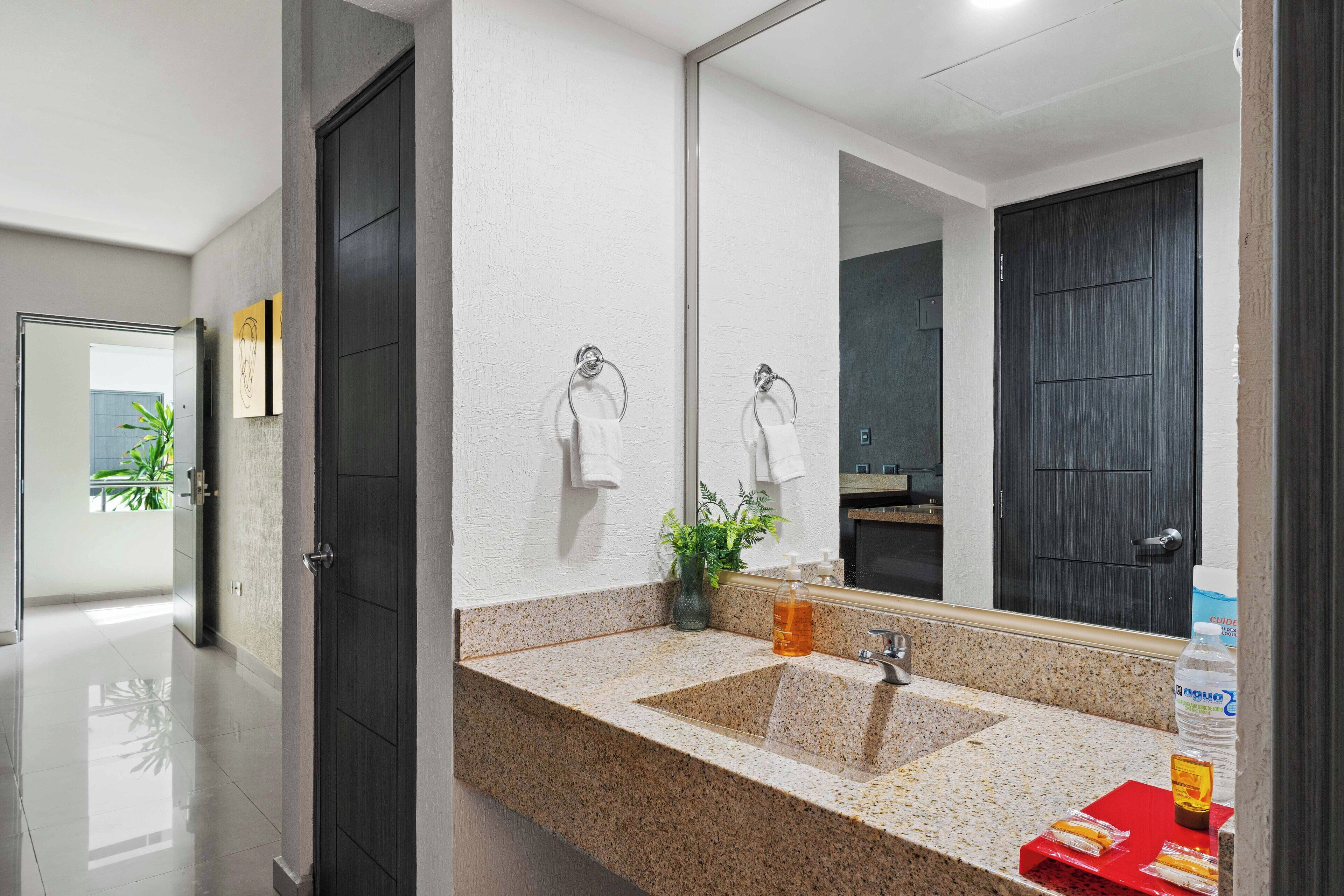 suite, 2 double beds | bathroom sink