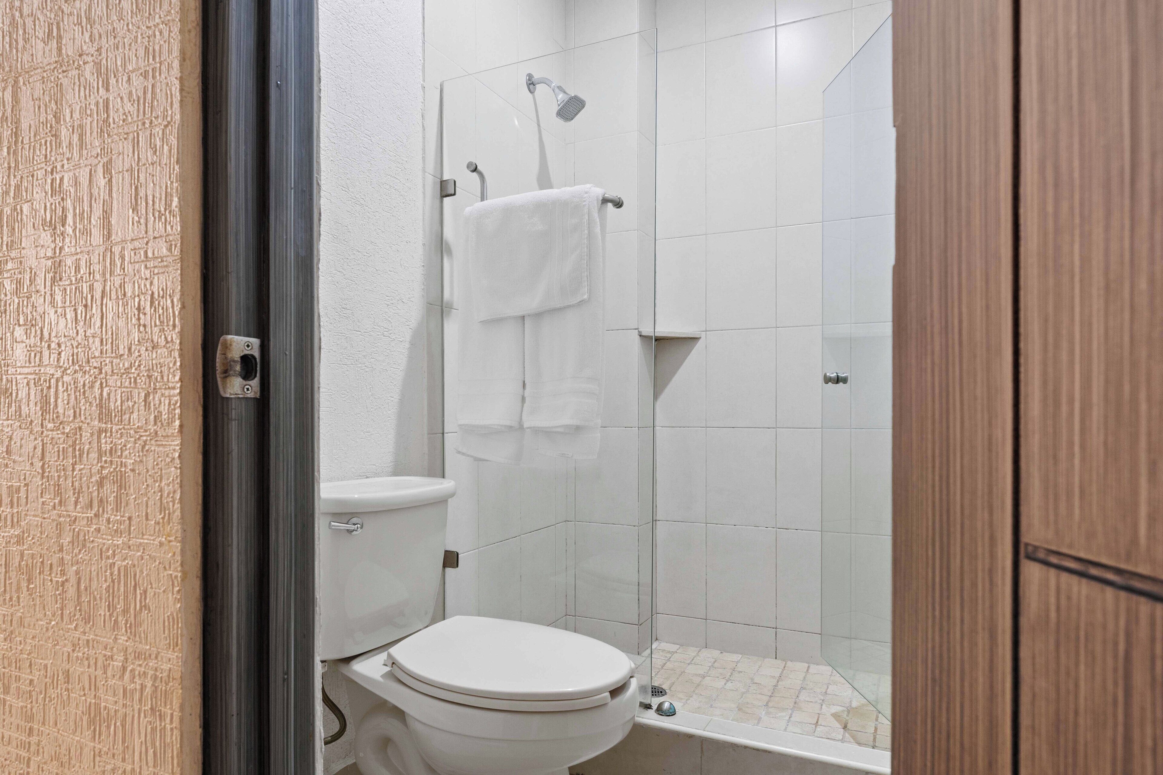 suite, 2 double beds | bathroom | shower, rainfall showerhead, free toiletries, hair dryer