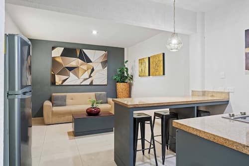 Suite, 2 Double Beds | Living area | 40-inch Smart TV with cable channels, Netflix, streaming services