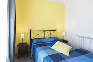 Apartment, 1 Bedroom | Desk, iron/ironing board, free WiFi, bed sheets