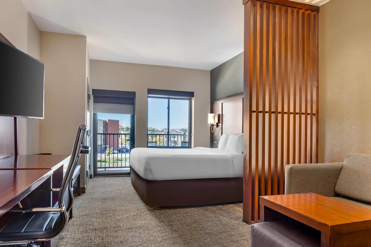 Premium bedding, desk, laptop workspace, iron/ironing board