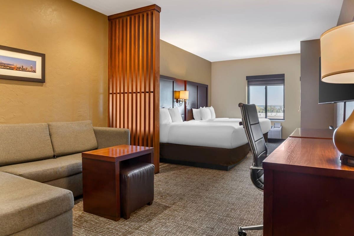 Premium bedding, desk, laptop workspace, iron/ironing board