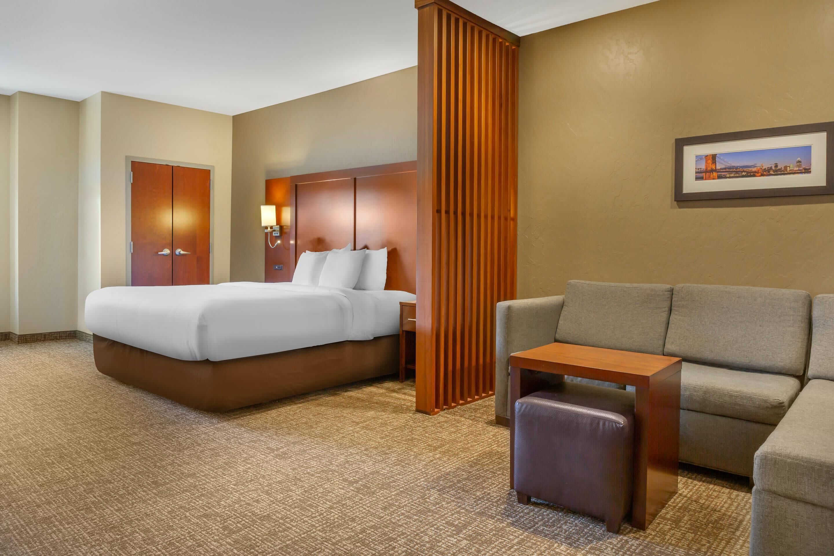 Premium bedding, desk, laptop workspace, iron/ironing board