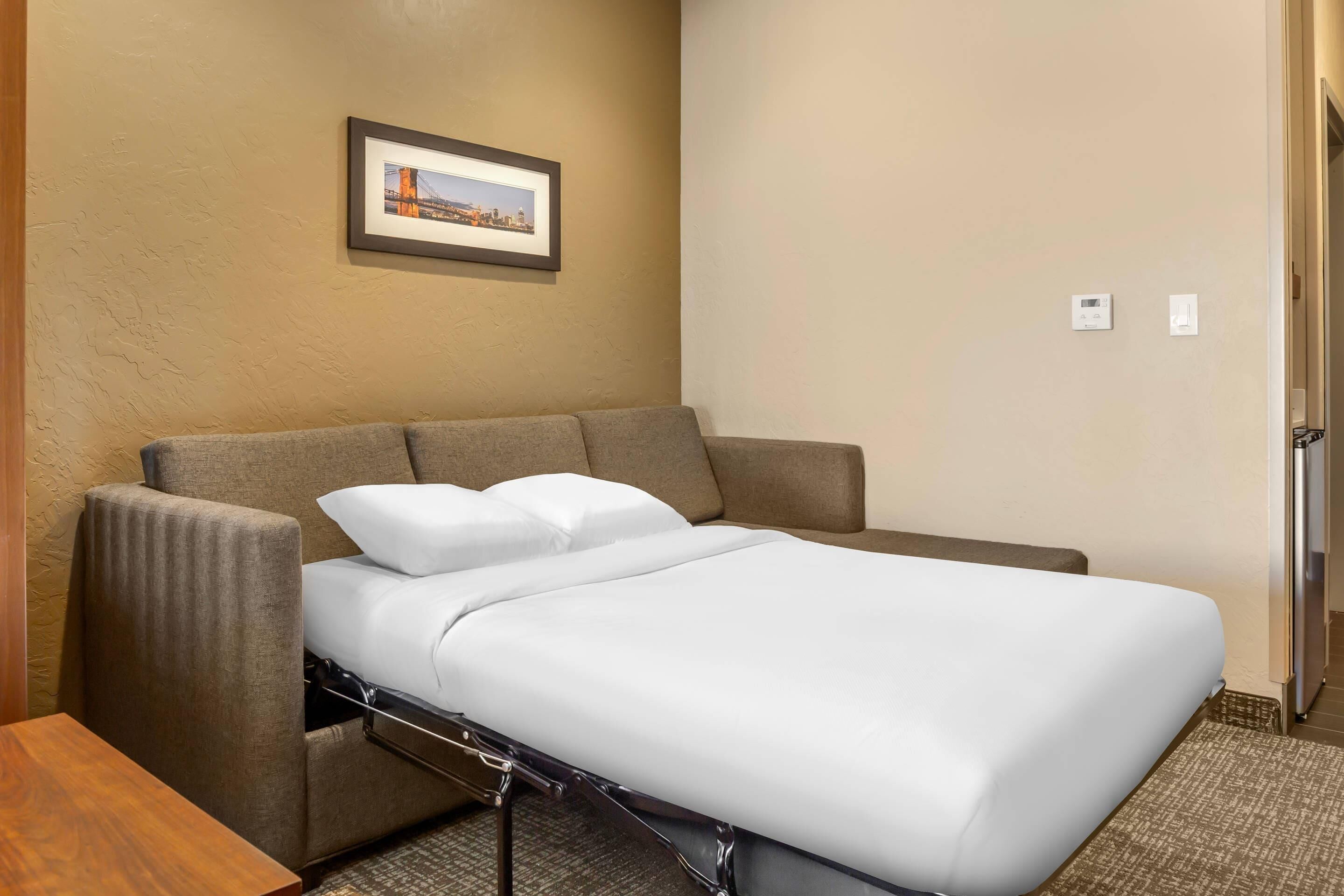 Premium bedding, desk, laptop workspace, iron/ironing board