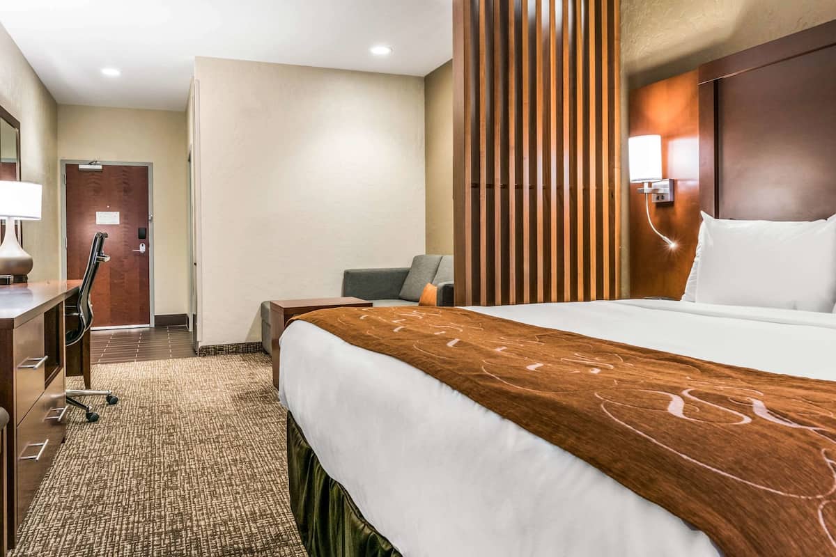 Premium bedding, desk, laptop workspace, iron/ironing board