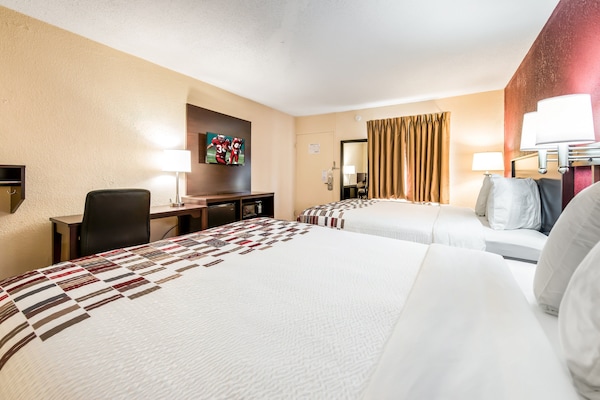 Desk, blackout drapes, cribs (free), WiFi (free)