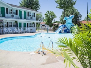Seasonal outdoor pool, open 8:30 AM to 10:00 PM, pool umbrellas