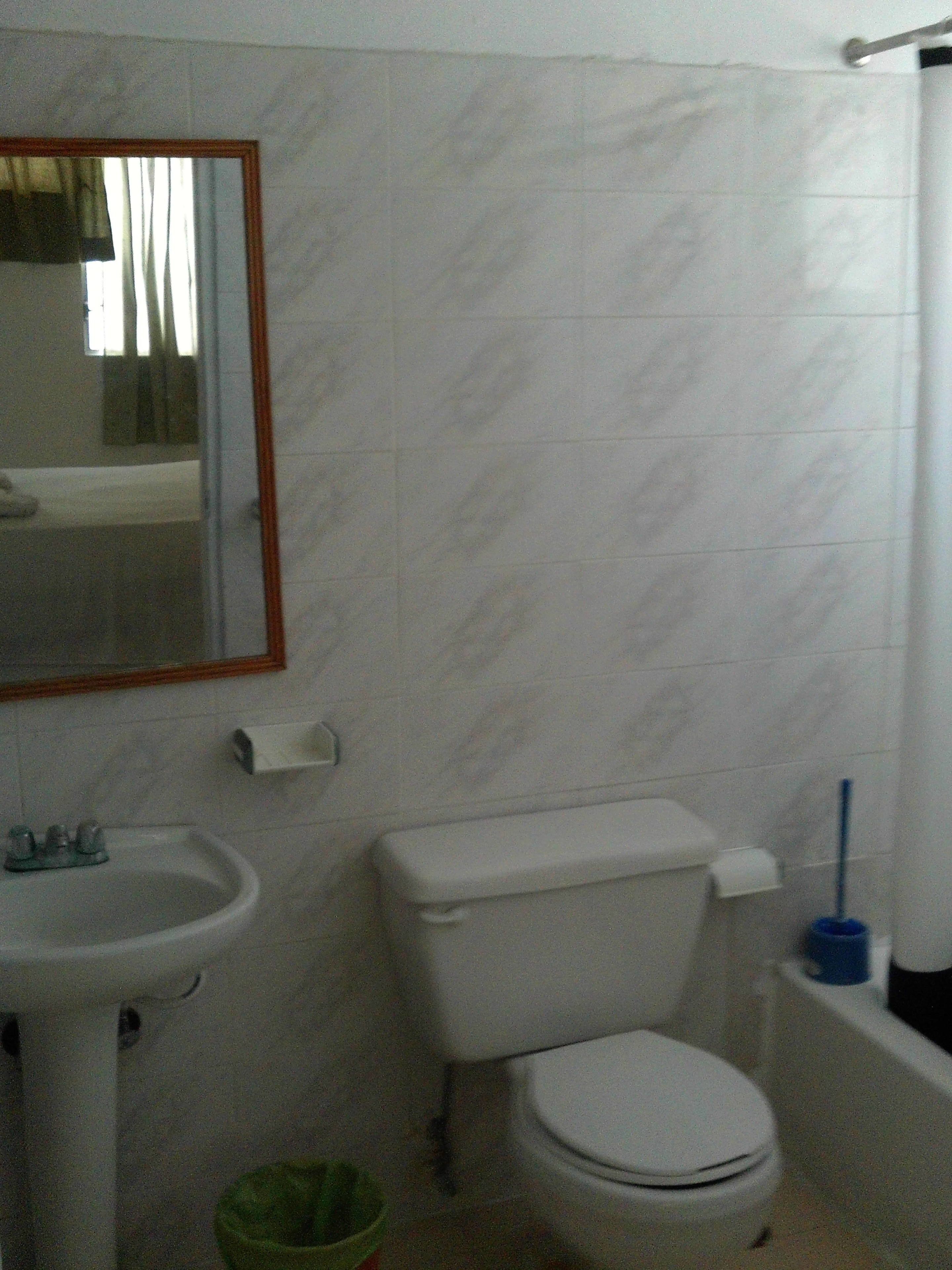 comfort apartment, 1 double bed, smoking, garden view | bathroom | shower, hair dryer, towels