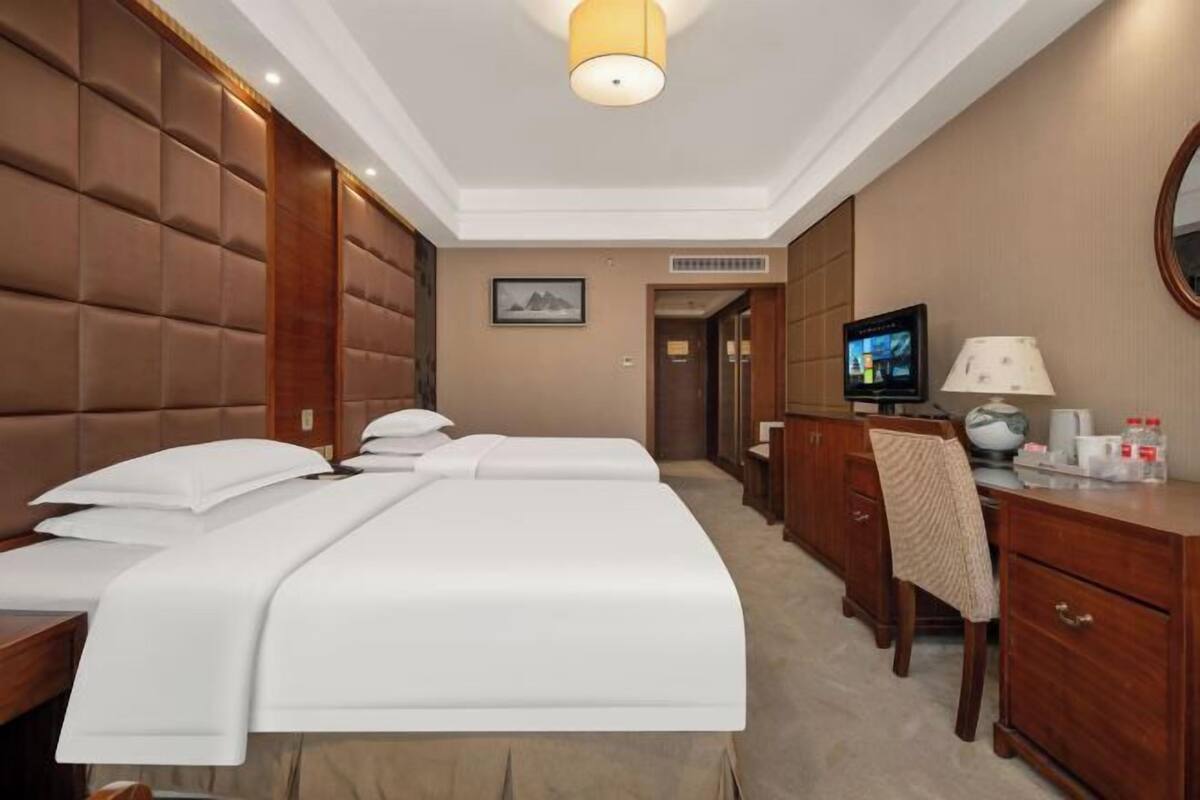 Minibar, desk, blackout curtains, iron/ironing board