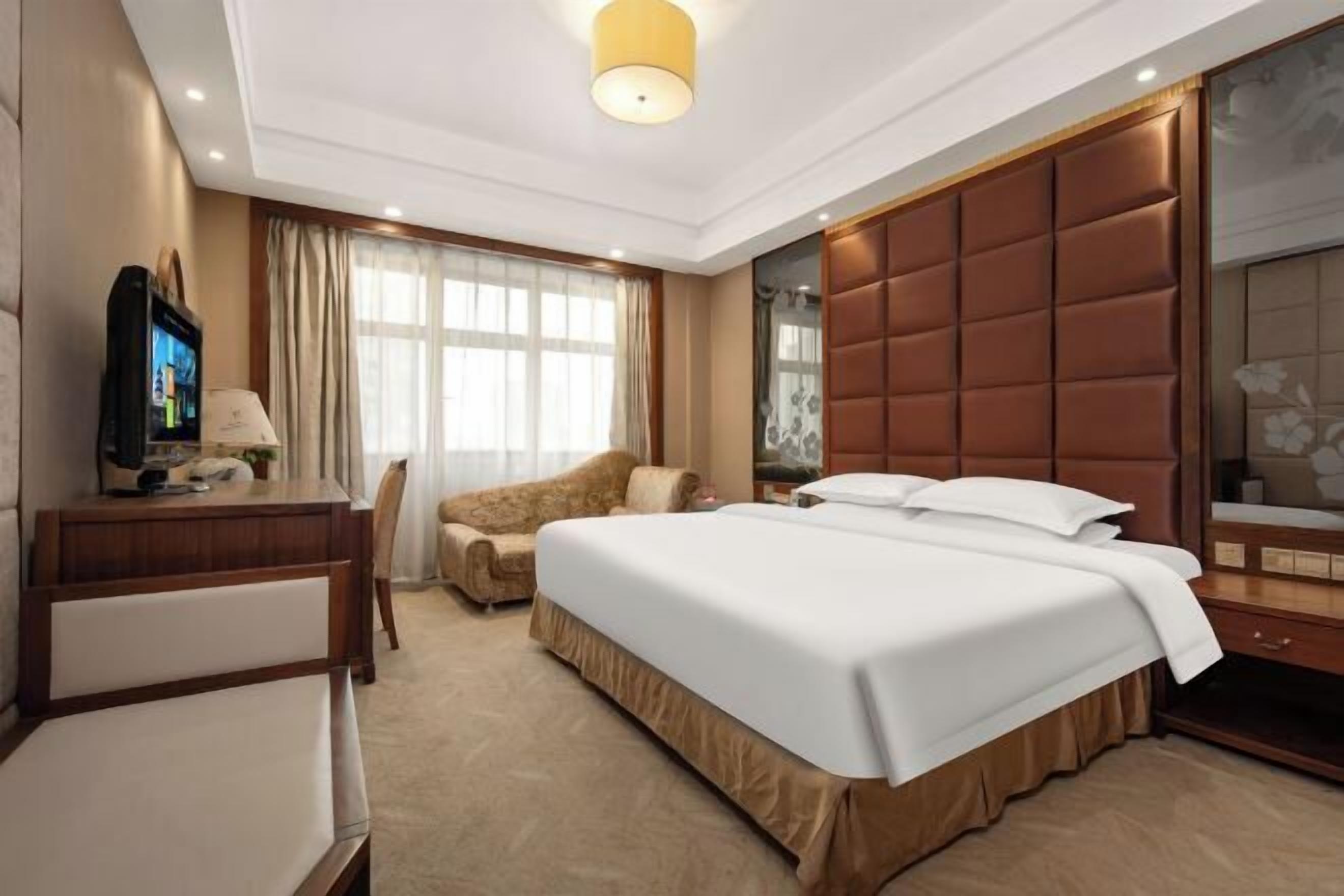 Minibar, desk, blackout curtains, iron/ironing board