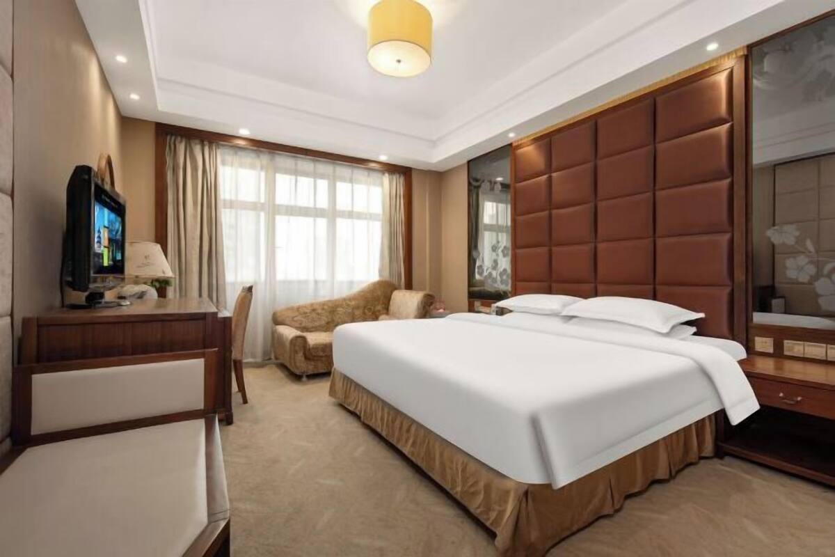 Minibar, desk, blackout curtains, iron/ironing board