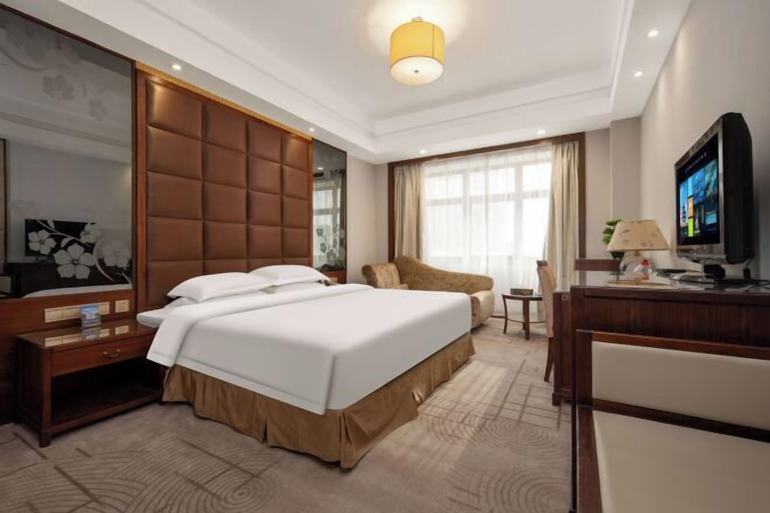 Minibar, desk, blackout curtains, iron/ironing board