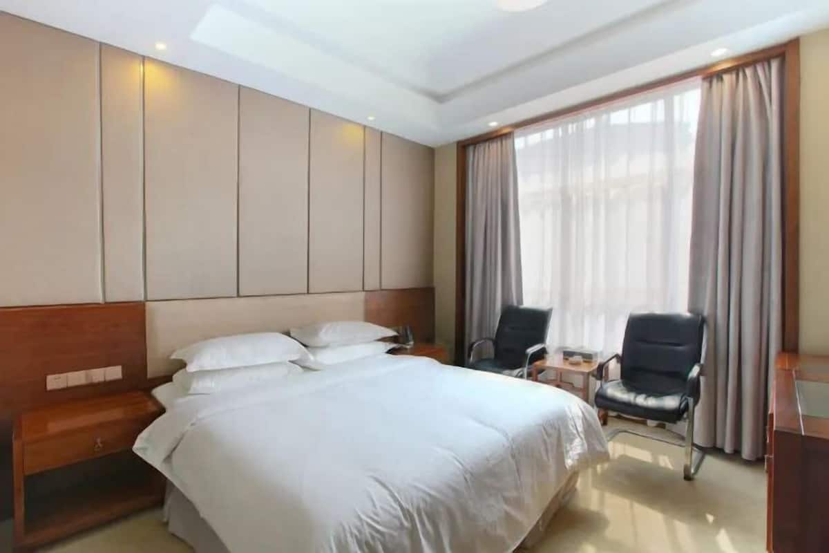 Minibar, desk, blackout drapes, iron/ironing board