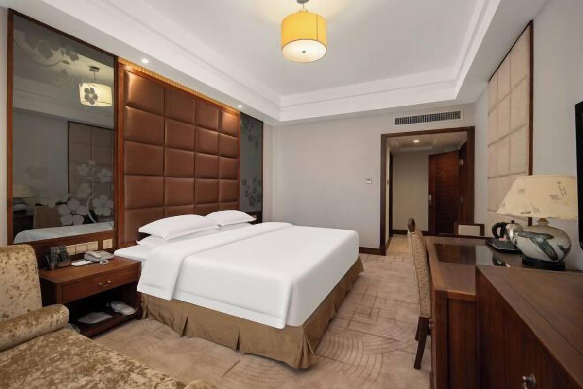 Minibar, desk, blackout curtains, iron/ironing board