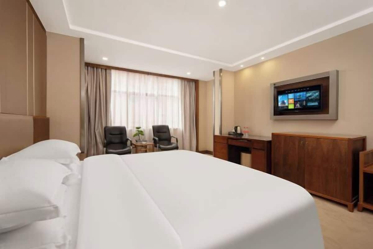 Minibar, desk, blackout curtains, iron/ironing board