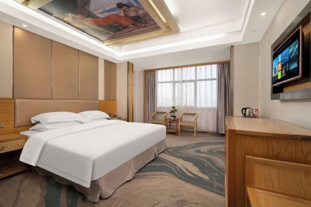 Minibar, desk, blackout curtains, iron/ironing board