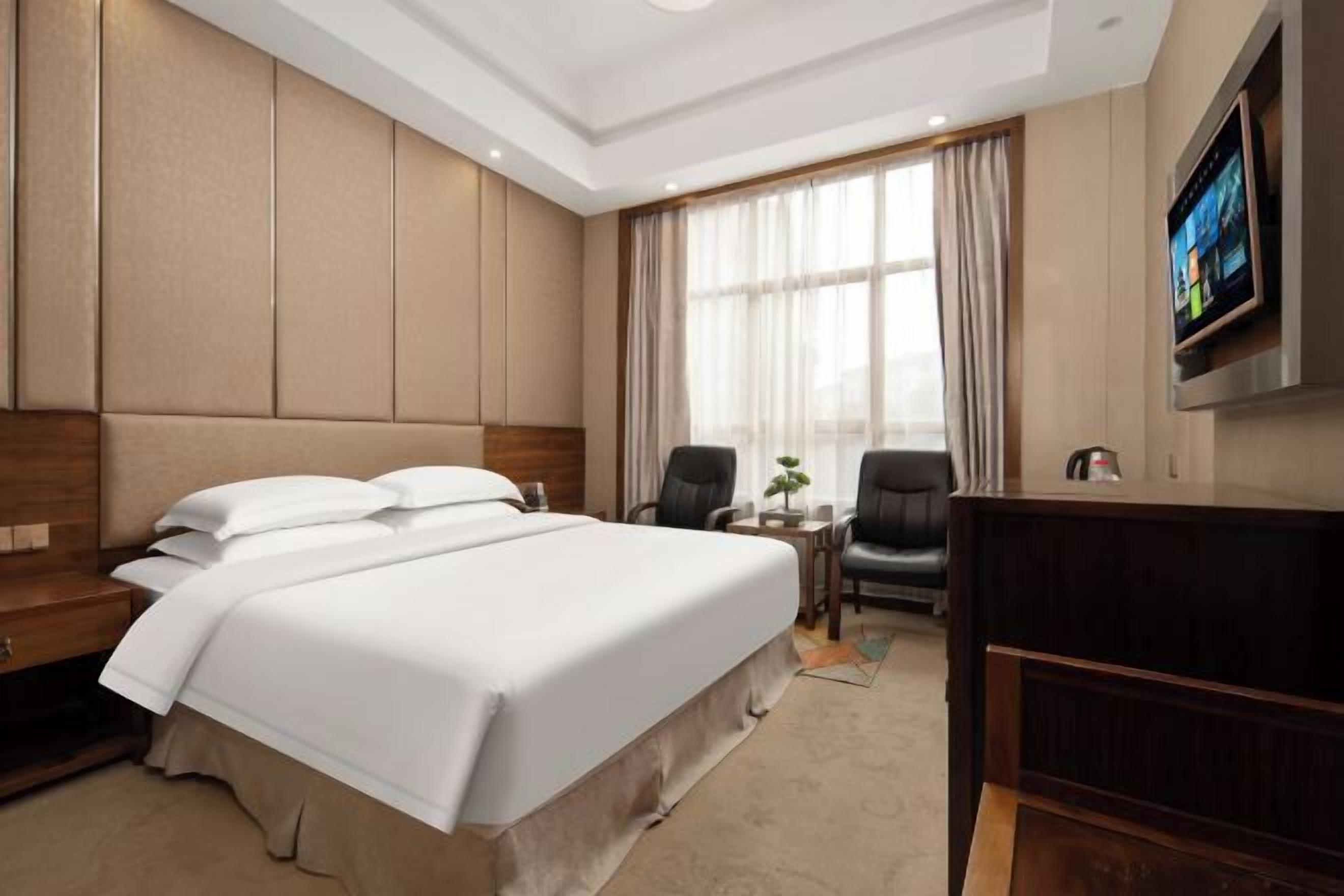 Minibar, desk, blackout drapes, iron/ironing board