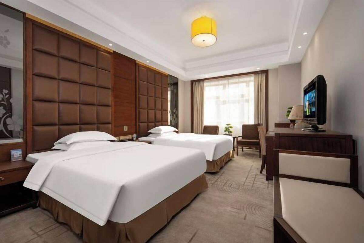 Minibar, desk, blackout drapes, iron/ironing board