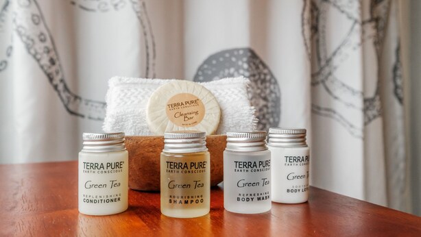 Three Terra Pure products on a wooden surface.