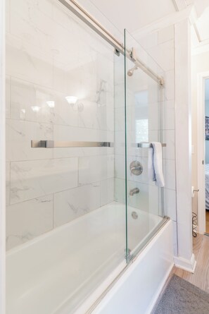Combined shower/tub, hair dryer, towels, toilet paper