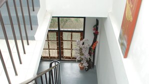 A staircase with metal railings leading to a lower level. - Sea & Sand Guesthouse and Restaurant (Cha-am)