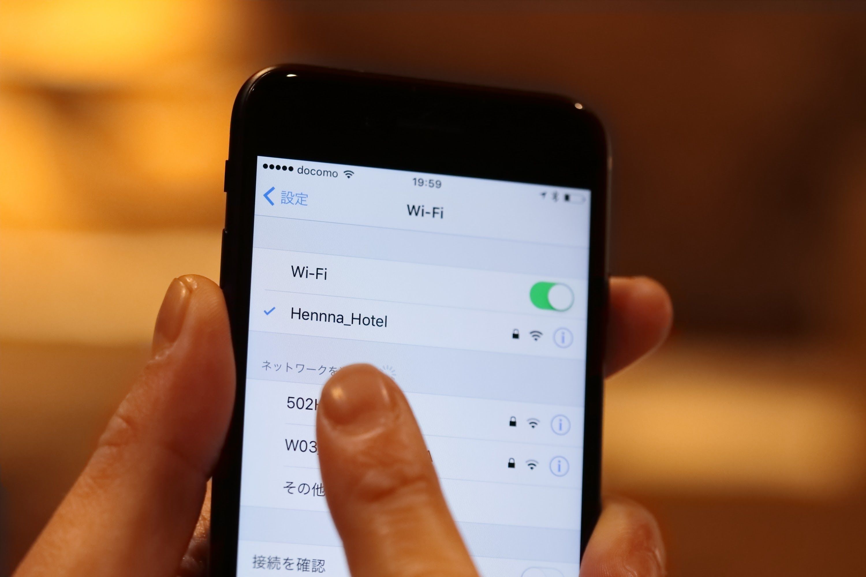 A smartphone displaying a Wi-Fi settings screen with a selected network named 'Hennna_Hotel'.
