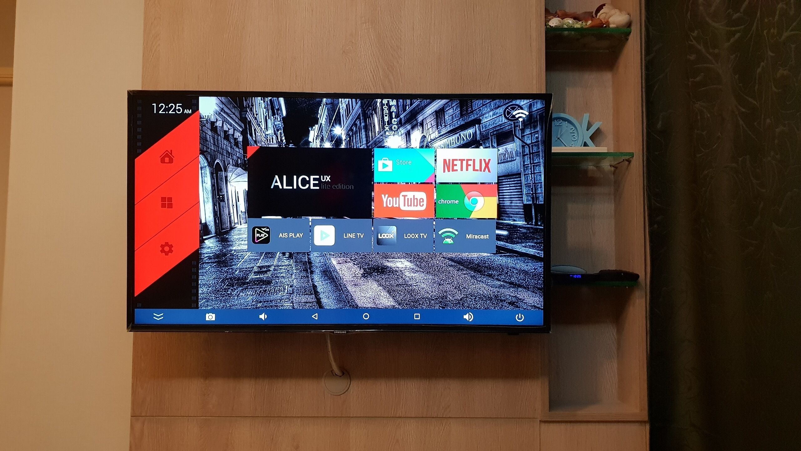 A television displaying a home screen with various streaming services and a clock showing 12:25 AM.